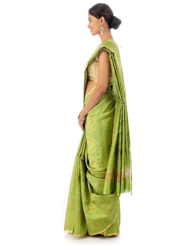 Picture of Pista Green Colored Hand Woven Cotton Shari Crafted with Lotus Art Design